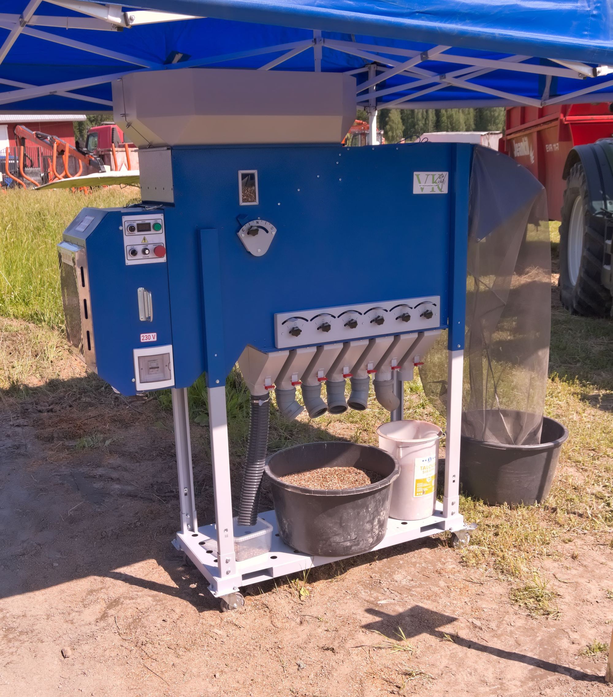 A grain cleaning machine separating grain through a row of sieves