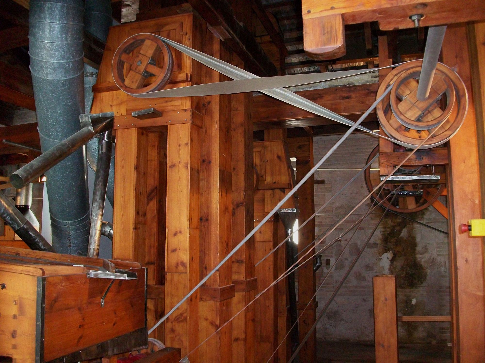 Belts and pulleys driving milling machinery