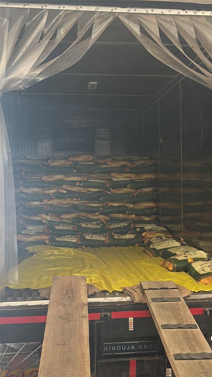 Bags of rice stacked inside a shipping container