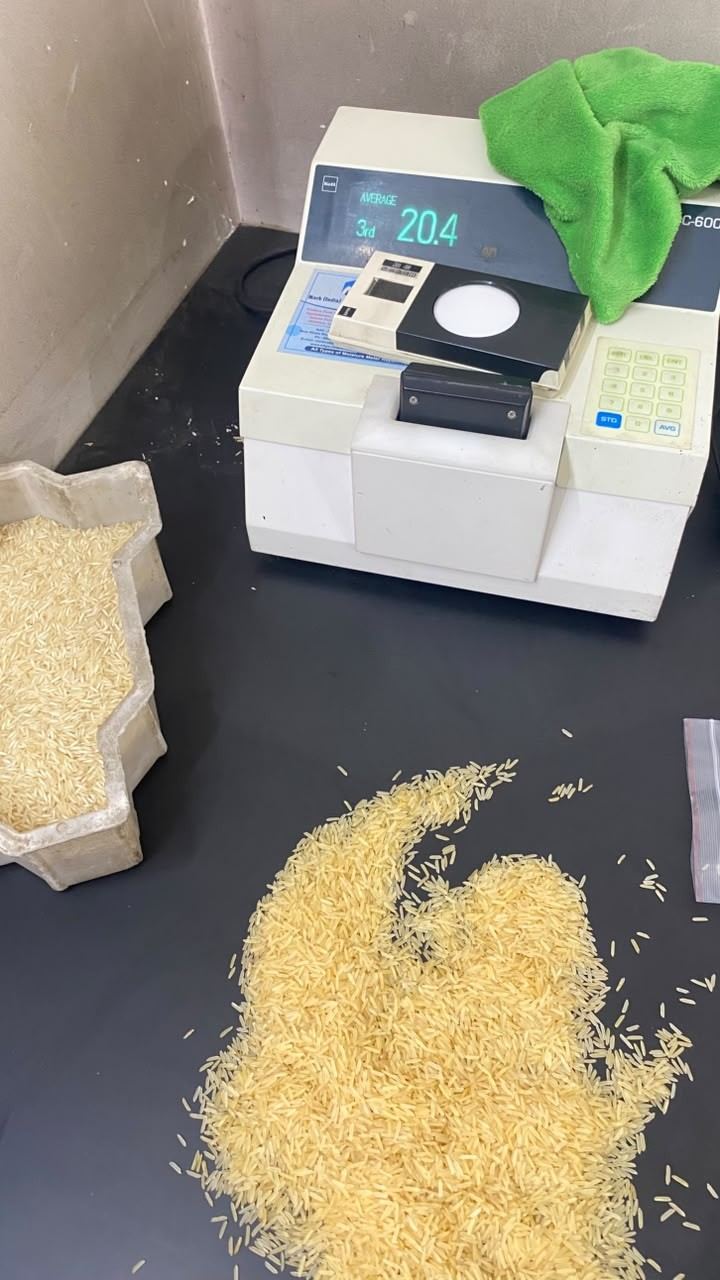 Rice samples beside a whiteness tester in the laboratory