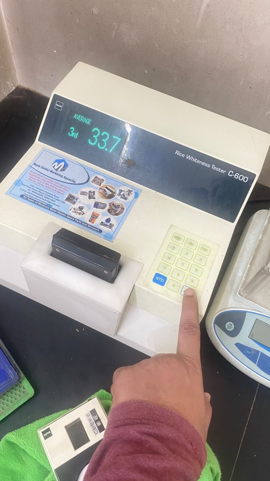 A rice whiteness tester in use